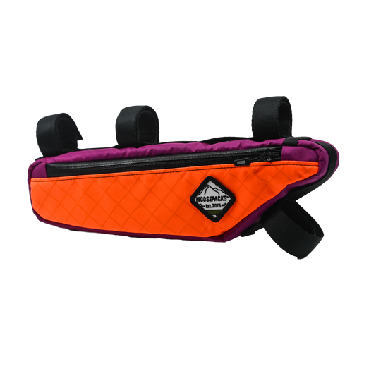 Orange and Fuchsia Frame bag with multiple pockets, adjustable straps and rigid foam inserts.