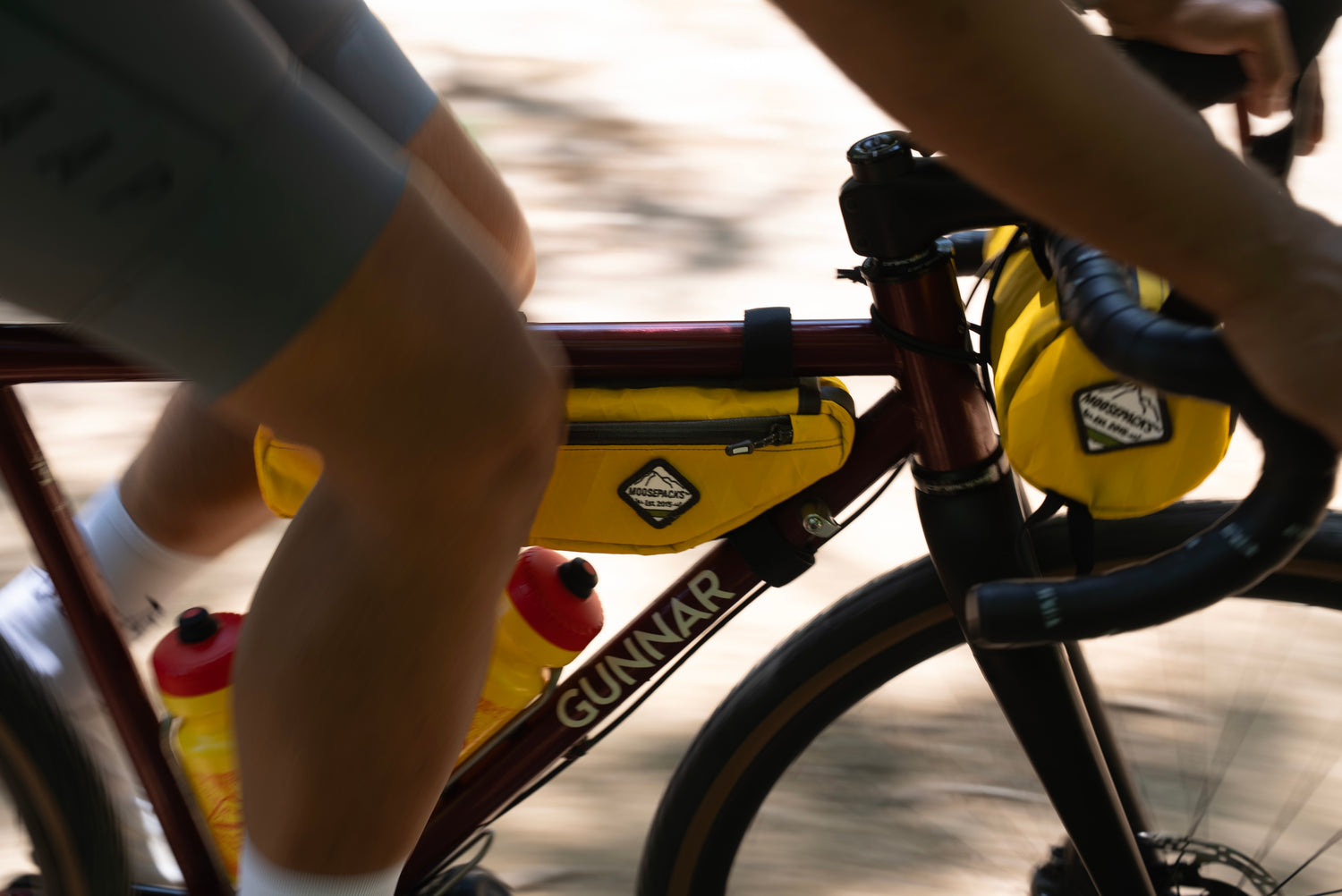 SunnySide Yellow frame bag and handlebar bag on steel gravel bike. 